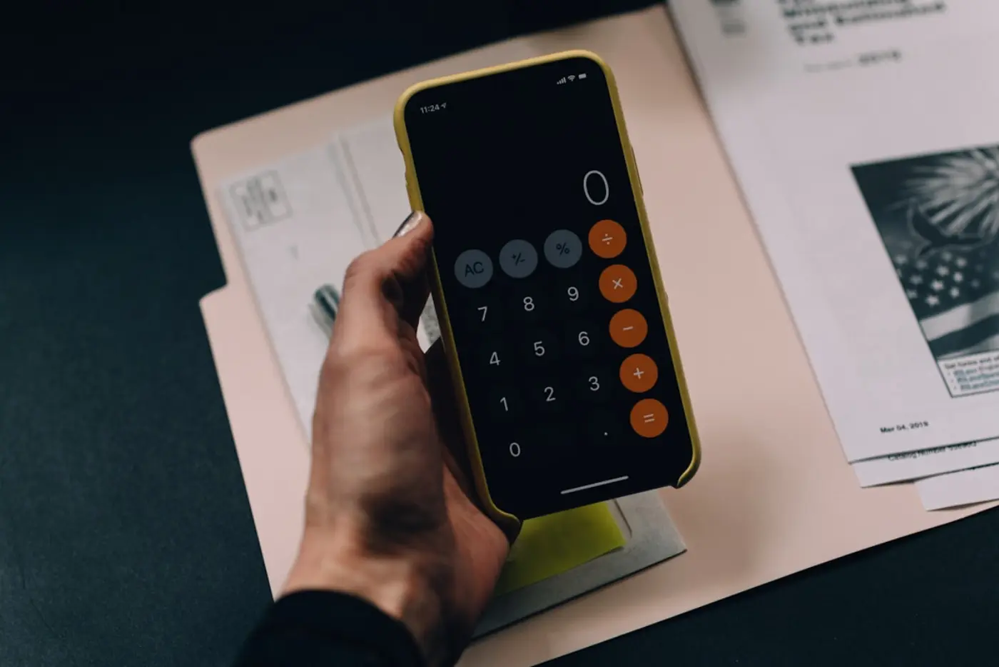 A person reviewing their growing credit score on a phone