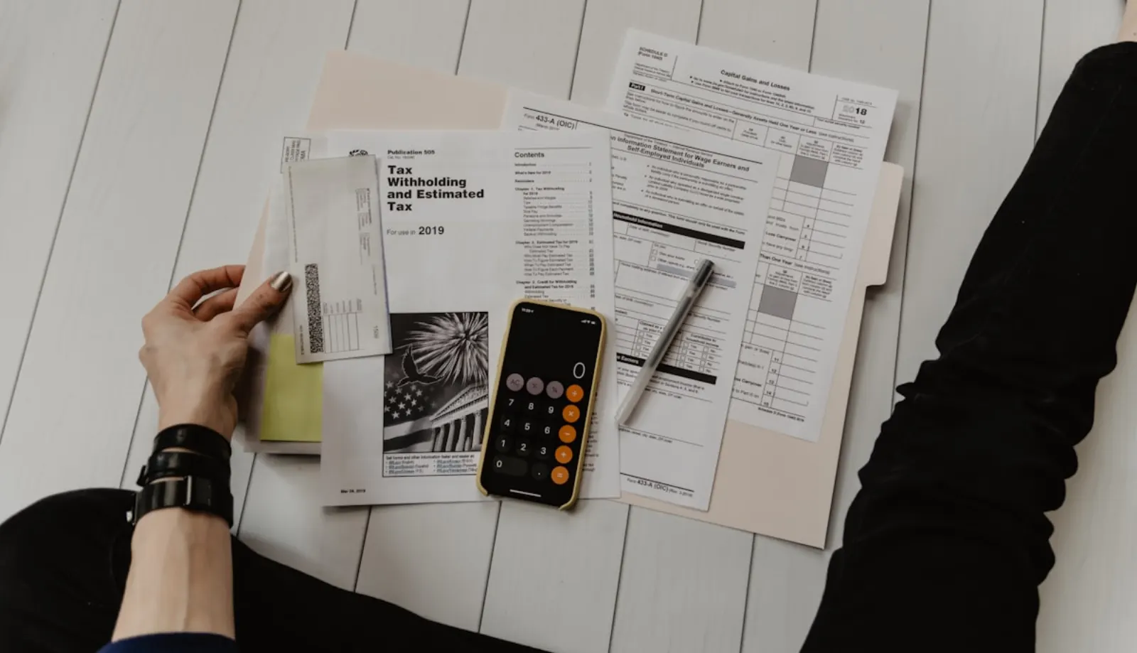 ITIN paperwork and credit bureau documents on a desk